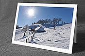 Fotokarte F144222: Winterlandschaft mit Alphütte im Gegenlicht